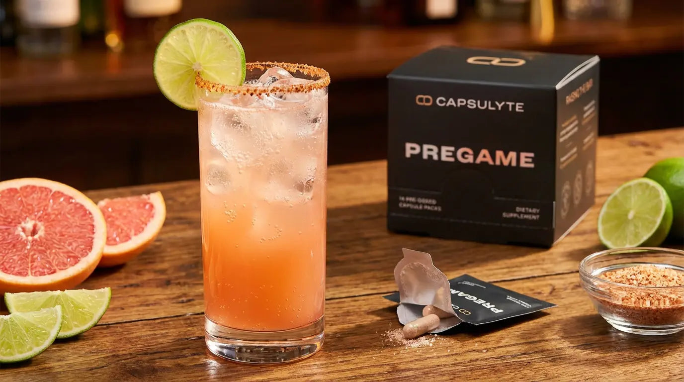 Spicy tamarind Paloma mocktail in a tall glass with Tajin-salt rim, lime wheel, and pink grapefruit garnish